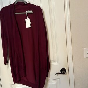 Maroon cardigan. New with tags. Size M